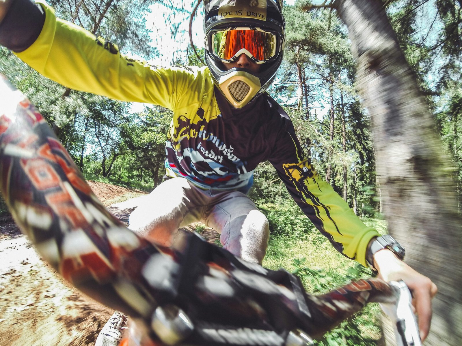 shallow focus photo of person riding bike